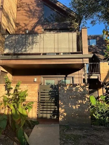 a view of a street with an outdoor seating