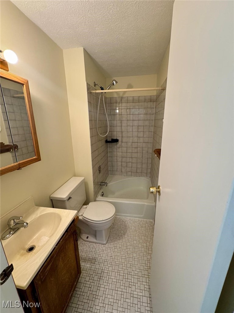17073 Drake Road Strongsville, OH 44136 - Photo 28 of 50 Full bath featuring vanity, shower / bath combination, and a textured ceiling
