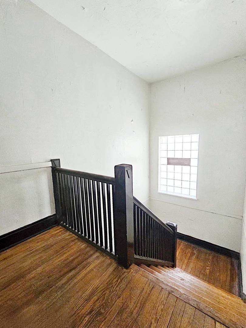 7949 South Rhodes Avenue Chicago, IL 60619 - Photo 11 of 14 a view of a wooden floor