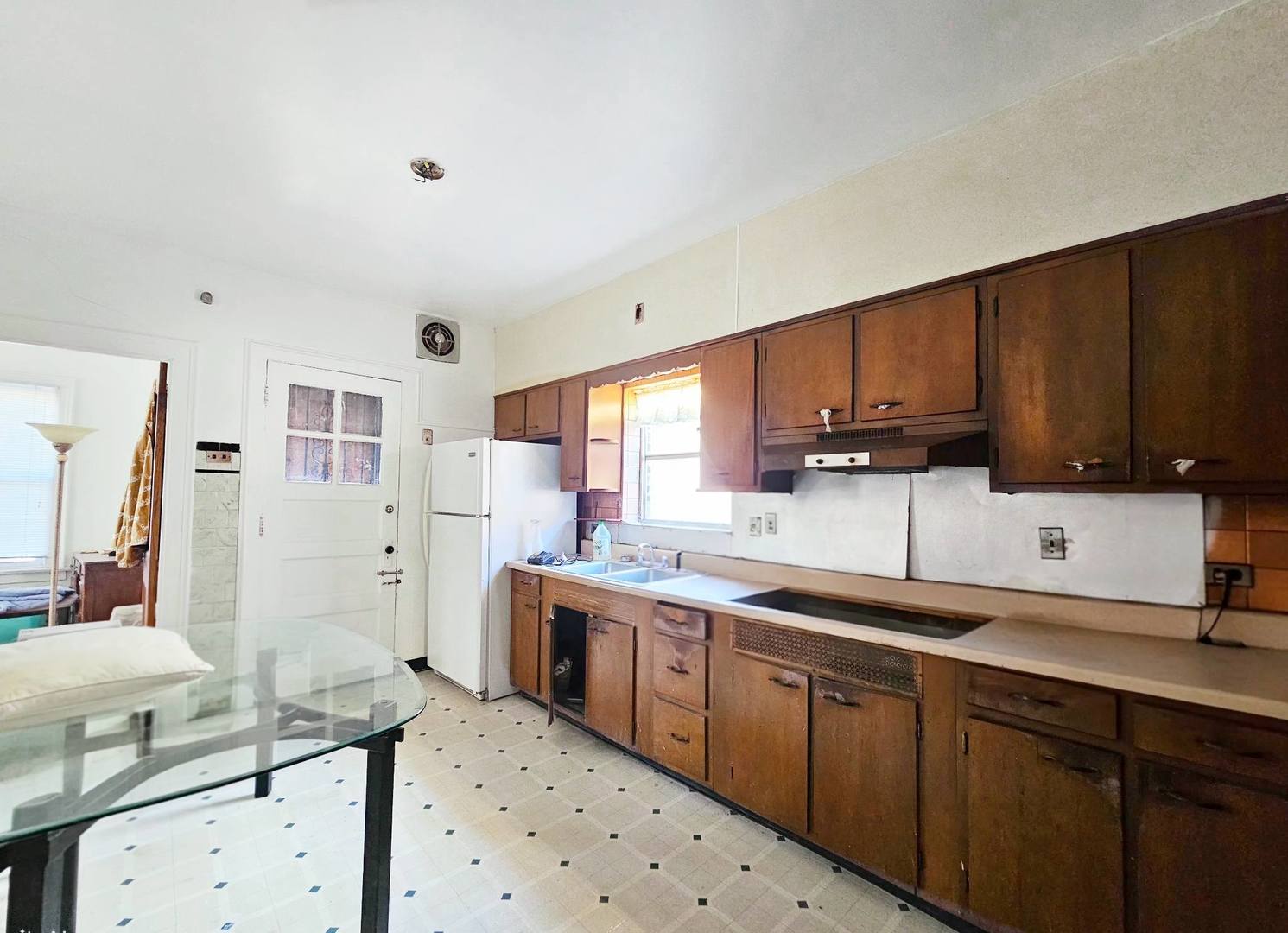 7949 South Rhodes Avenue Chicago, IL 60619 - Photo 3 of 14 a kitchen with stainless steel appliances a sink stove and cabinets