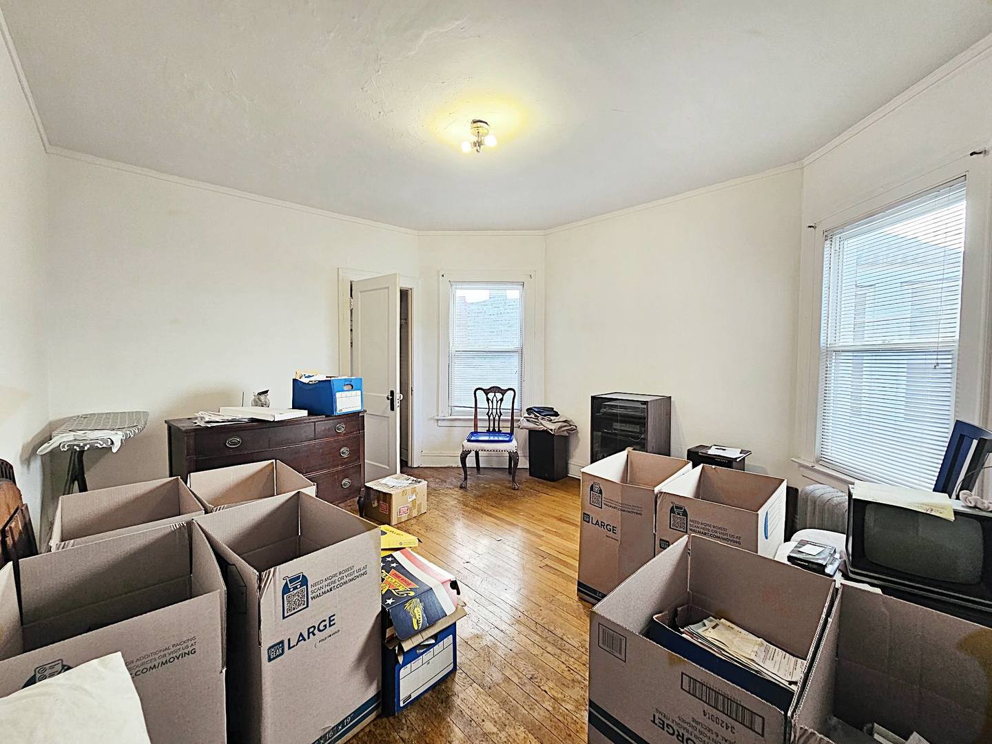 7949 South Rhodes Avenue Chicago, IL 60619 - Photo 7 of 14 a living room with furniture and a fireplace