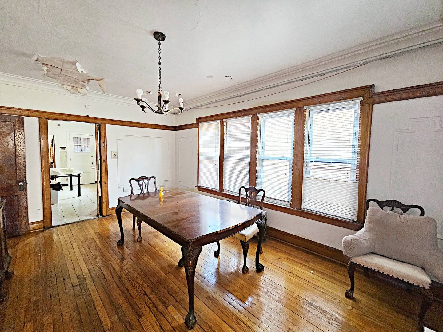7949 South Rhodes Avenue Chicago, IL 60619 - Photo 10 of 14 a living room with furniture a table and large windows