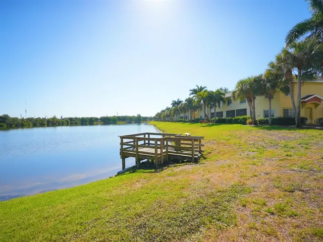 a view of a lake with houses in the back