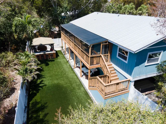 a aerial view of a house with a yard
