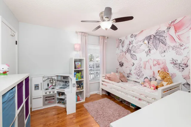 a living room with furniture and white walls