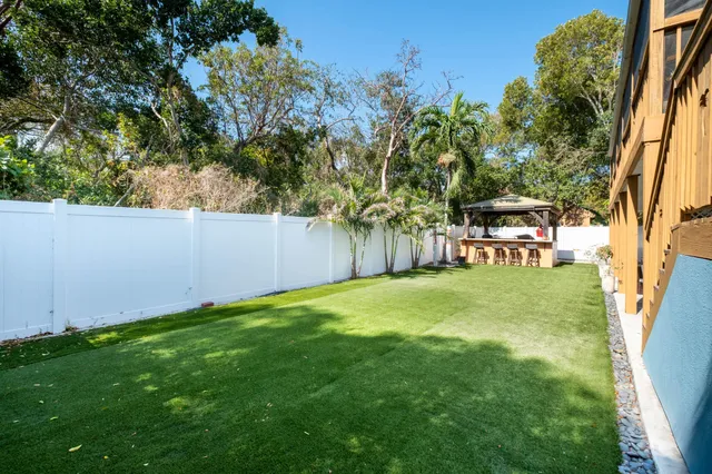 a view of a yard with a tree