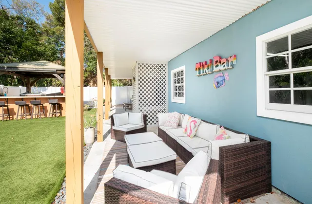 a outdoor living space with furniture and garden view