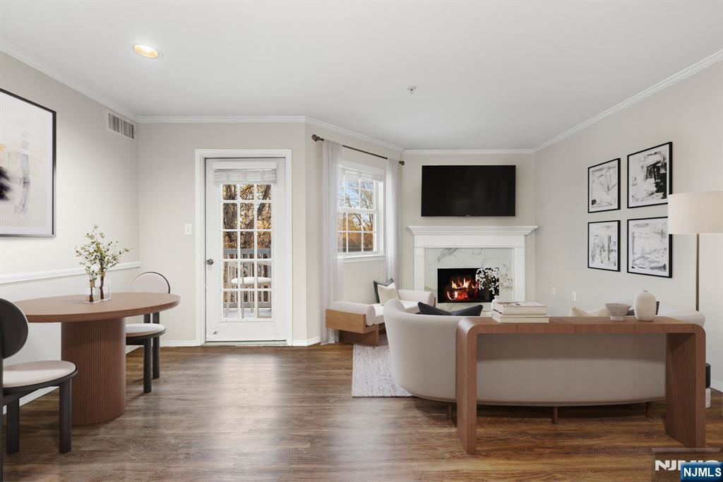 690 Route 23, Unit R2 Wayne, NJ 07470 - Photo 2 of 11 a living room with furniture a fireplace and a flat screen tv