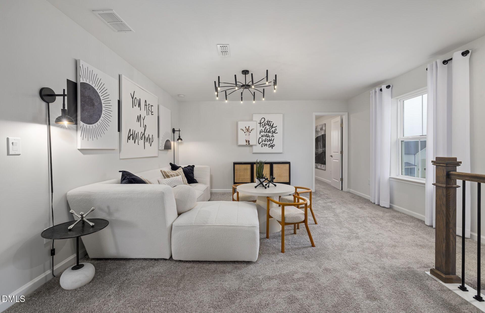 413 Grange Farm Place Raleigh, NC 27603 - Photo 15 of 33 a living room with furniture and a table