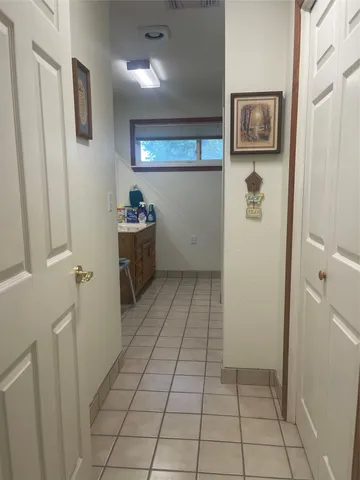 a view of a refrigerator in kitchen and microwave