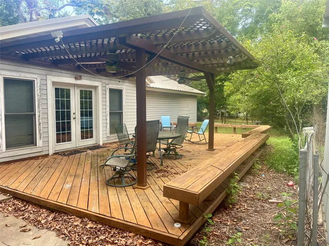 a view of swimming pool with sitting area
