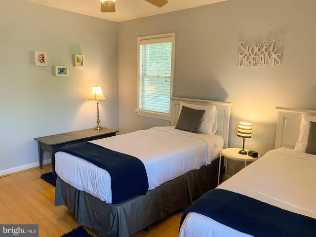 a bedroom with double bed and a window