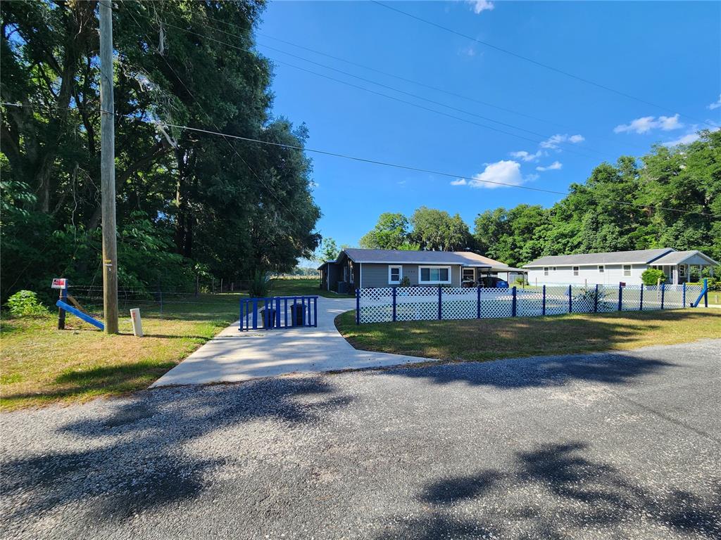 Northeast 36th Street Ocala, FL 34479 - Photo 13 of 16 a view of a house with backyard and swimming pool