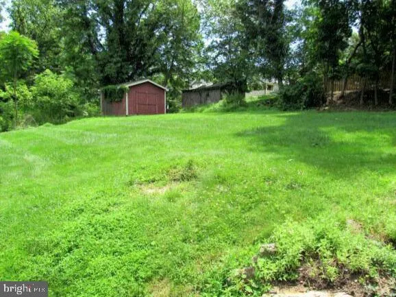 a kitchen with stainless steel appliances granite countertop a refrigerator and a stove
