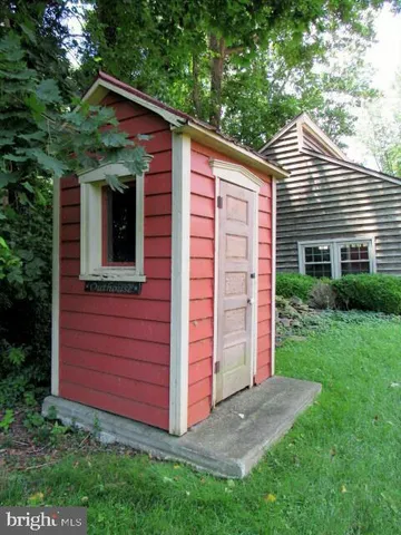 a kitchen with granite countertop a sink and a wooden cabinets