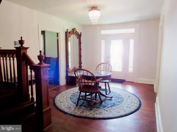 a view of a livingroom with furniture window and wooden floor