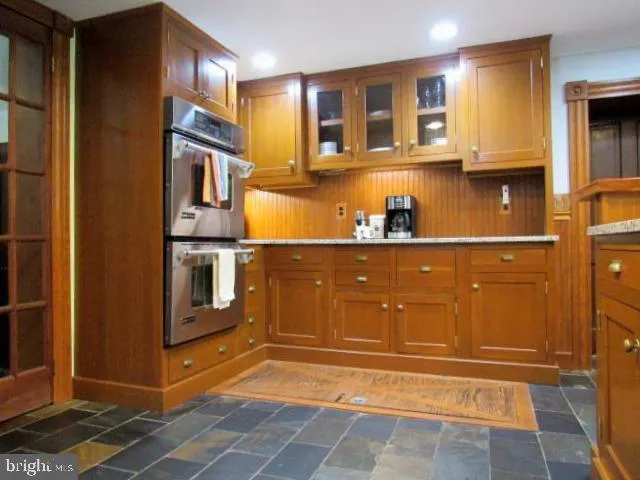 a view of a room with a table and a mirror