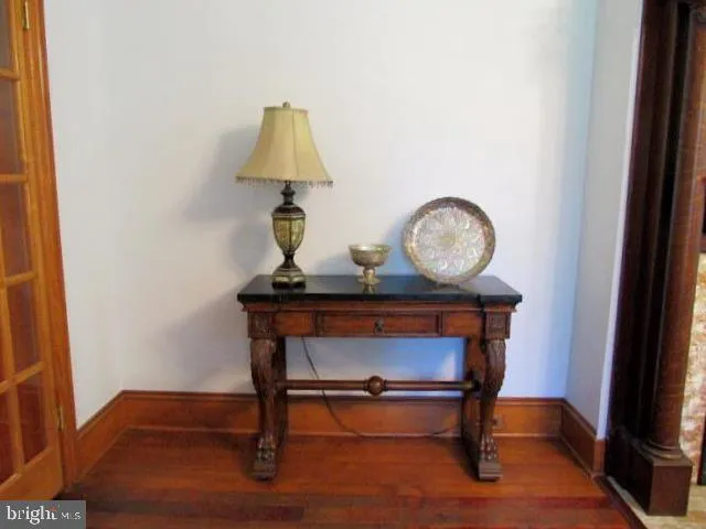 a living room with furniture fireplace and a window