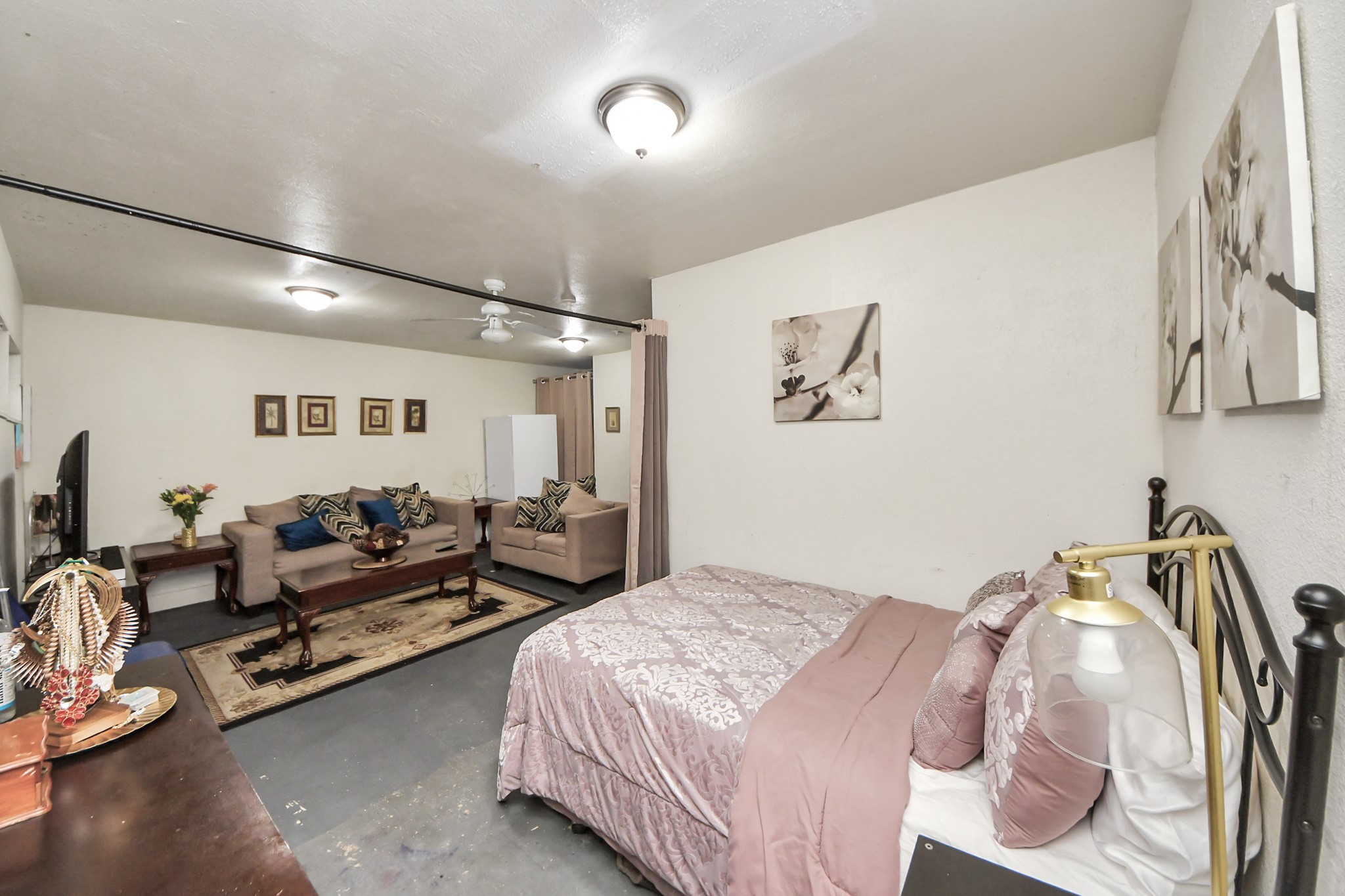 4155 Amir Street Houston, TX 77072 - Photo 30 of 43 a bedroom with a bed and wooden floor