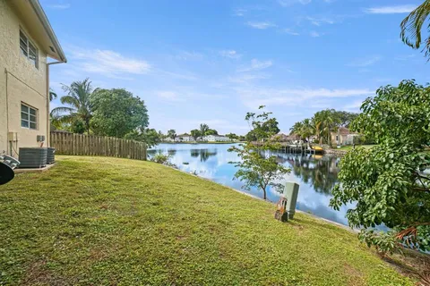 a view of yard with swimming pool and green space