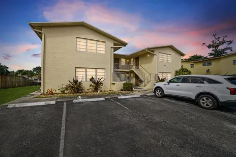 a view of a car parked in front of a house