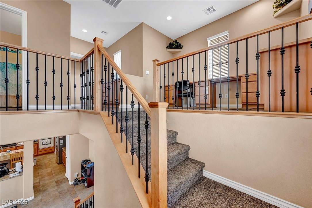8208 Seven Falls Street North Las Vegas, NV 89085 - Photo 21 of 69 Stairs featuring baseboards and recessed lighting