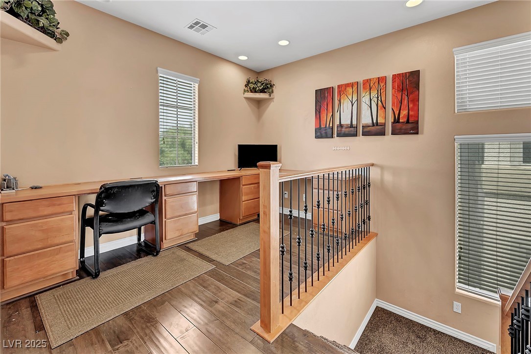 8208 Seven Falls Street North Las Vegas, NV 89085 - Photo 23 of 69 Home office featuring recessed lighting, wood finished floors, and built in desk