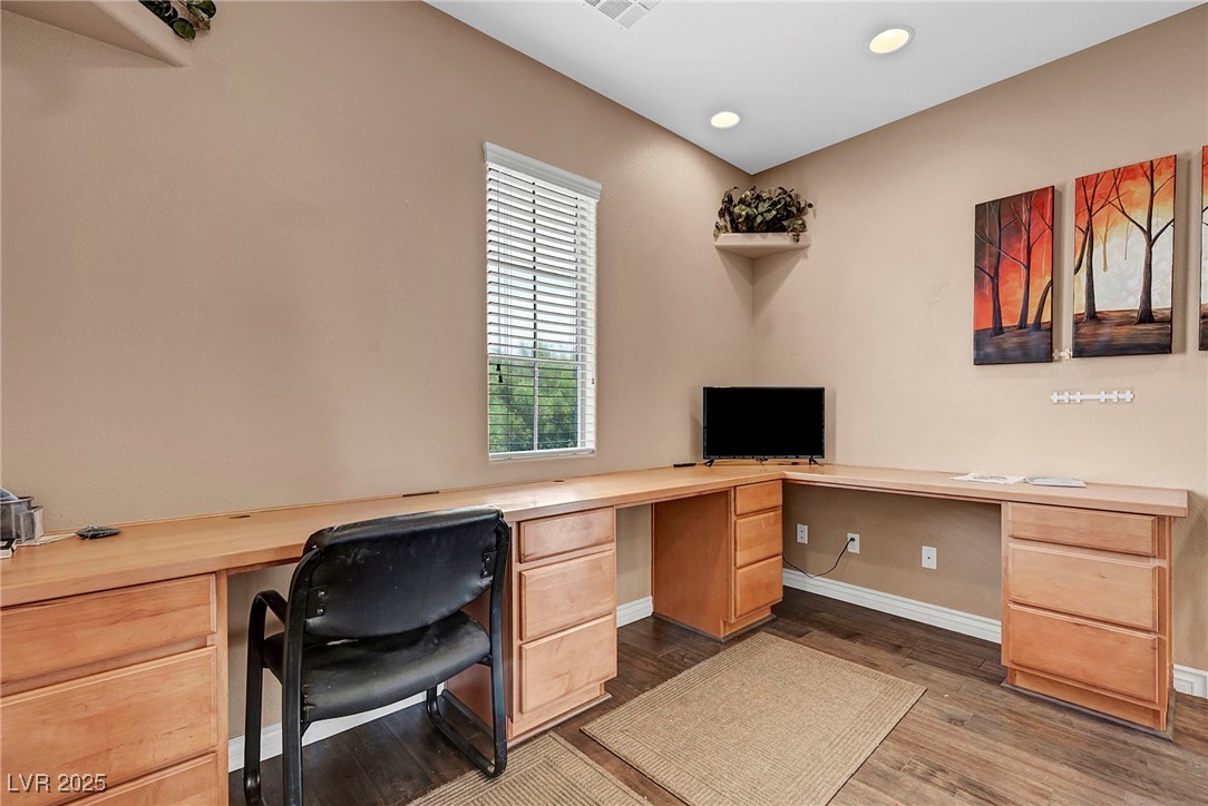 8208 Seven Falls Street North Las Vegas, NV 89085 - Photo 24 of 69 Office area featuring dark wood-type flooring, built in study area, and recessed lighting