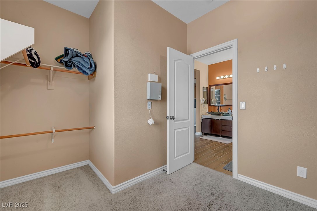 8208 Seven Falls Street North Las Vegas, NV 89085 - Photo 29 of 69 Walk in closet with carpet