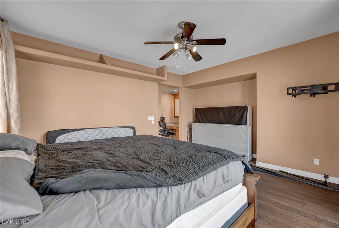 8208 Seven Falls Street North Las Vegas, NV 89085 - Photo 34 of 69 Bedroom with dark wood finished floors and a ceiling fan