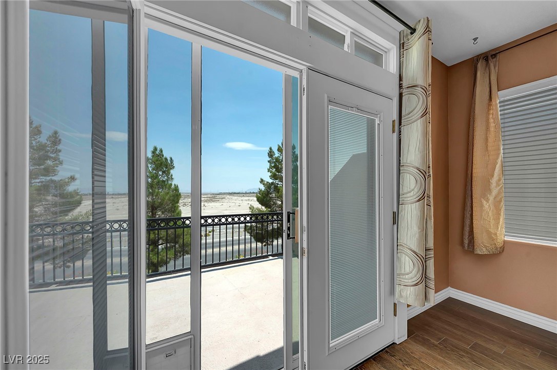 8208 Seven Falls Street North Las Vegas, NV 89085 - Photo 36 of 69 Entryway featuring dark wood-style floors and baseboards