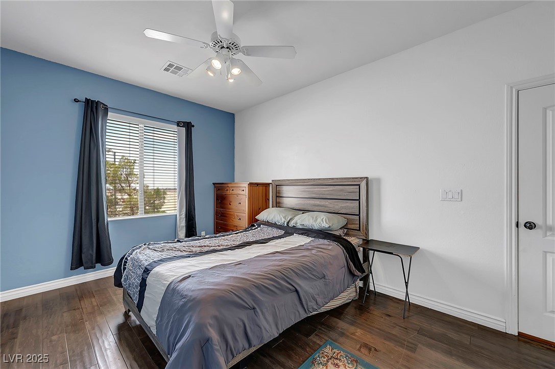 8208 Seven Falls Street North Las Vegas, NV 89085 - Photo 46 of 69 Bedroom with wood-type flooring and a ceiling fan