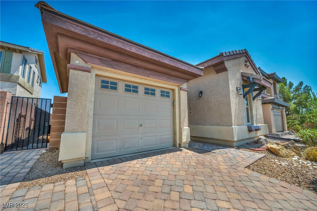 8208 Seven Falls Street North Las Vegas, NV 89085 - Photo 62 of 69 Garage with decorative driveway