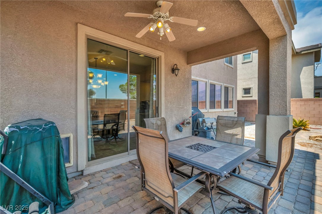 8208 Seven Falls Street North Las Vegas, NV 89085 - Photo 64 of 69 View of patio / terrace with outdoor dining space and ceiling fan