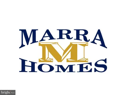 a aerial view of a residential apartment building with a yard