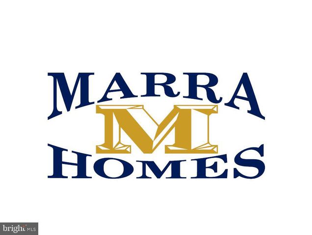 a aerial view of a residential apartment building with a yard