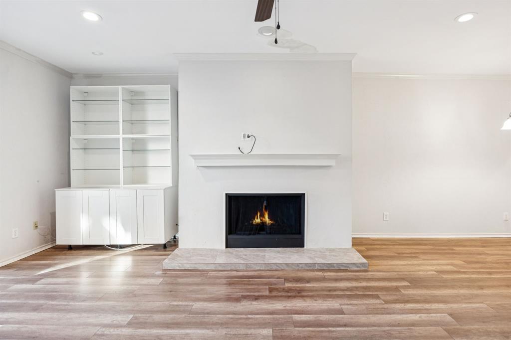 5310 Keller Springs Road, Unit 221 Dallas, TX 75248 - Photo 11 of 29 a view of fireplace and wooden floor