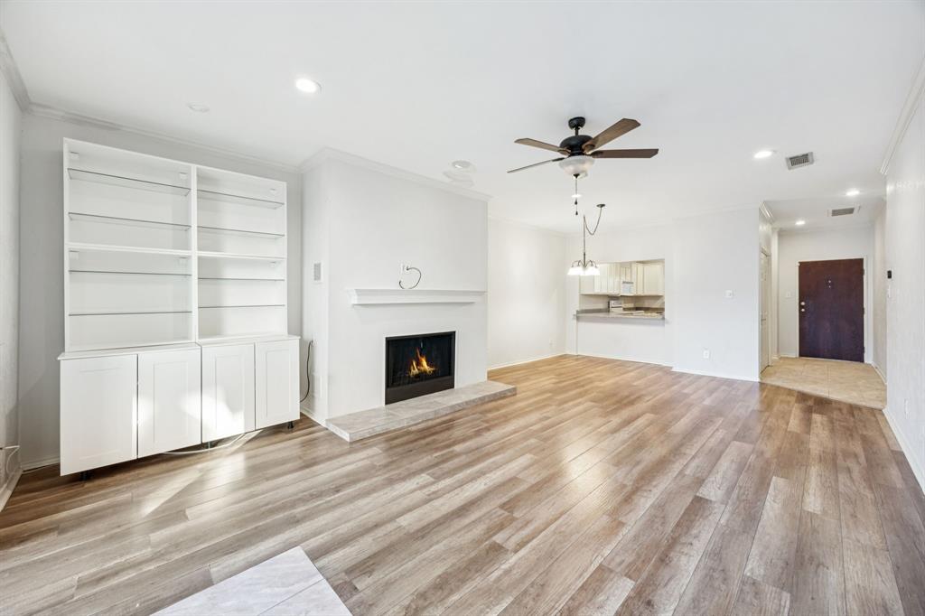 5310 Keller Springs Road, Unit 221 Dallas, TX 75248 - Photo 12 of 29 a view of a room with cabinet and a fireplace