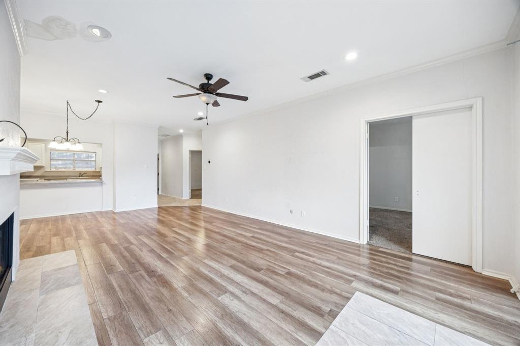 5310 Keller Springs Road, Unit 221 Dallas, TX 75248 - Photo 13 of 29 wooden floor in an empty room with a window