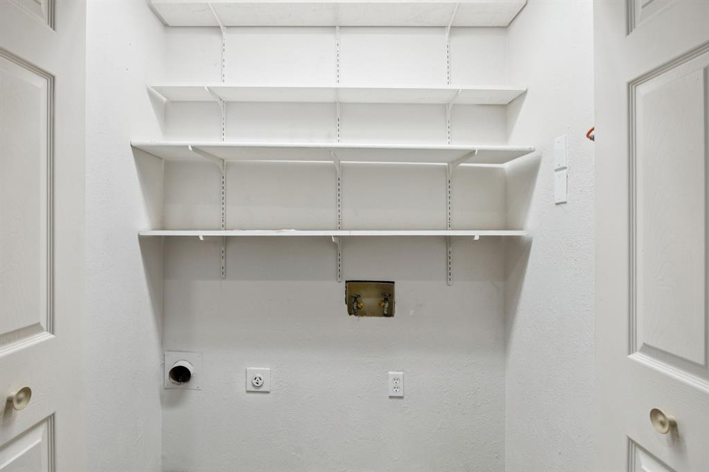 5310 Keller Springs Road, Unit 221 Dallas, TX 75248 - Photo 22 of 29 a view of cabinets and shelf