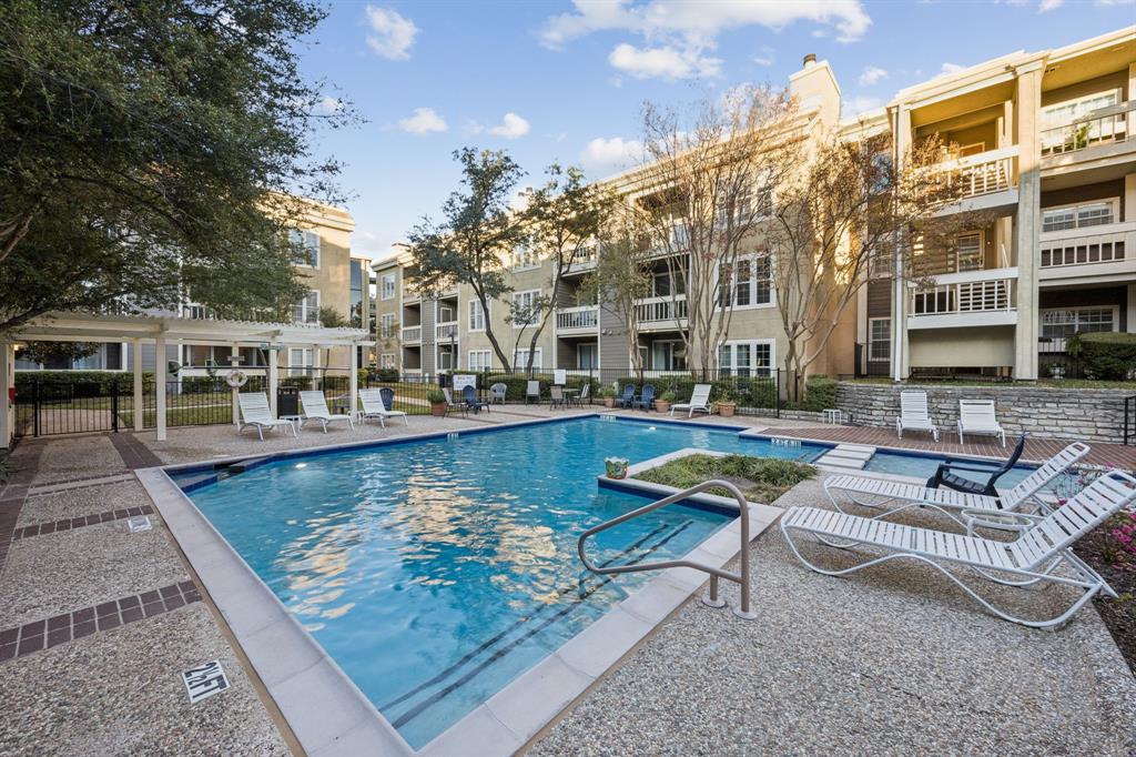 5310 Keller Springs Road, Unit 221 Dallas, TX 75248 - Photo 28 of 29 a view of a swimming pool with outdoor seating