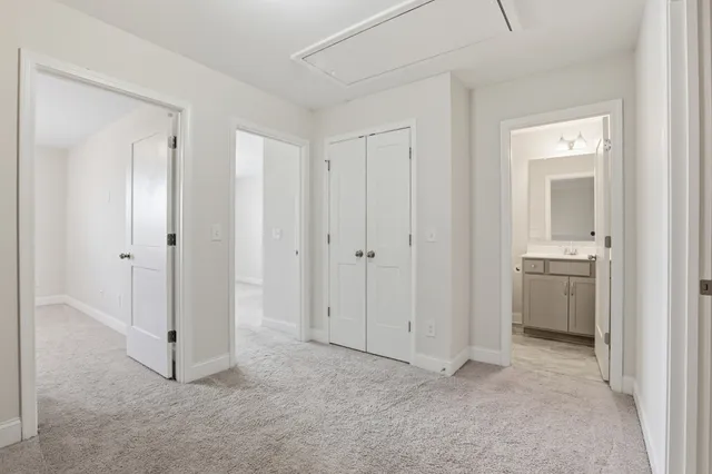 a view of a bathroom with a sink and a mirror