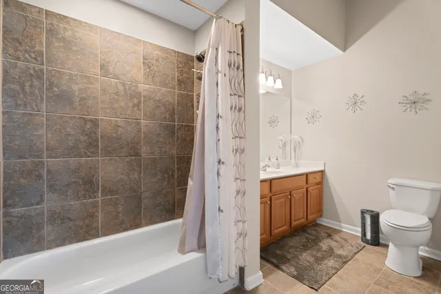 a bathroom with a shower and a toilet