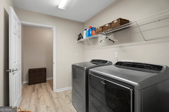 a utility room with dryer and washer