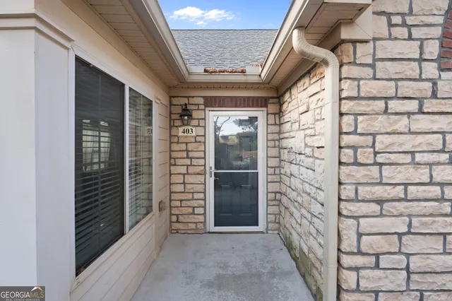 a view of entryway with a brick wall
