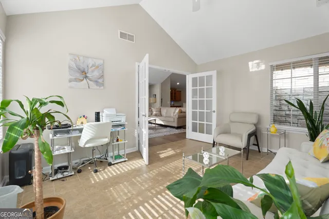 a living room with patio furniture