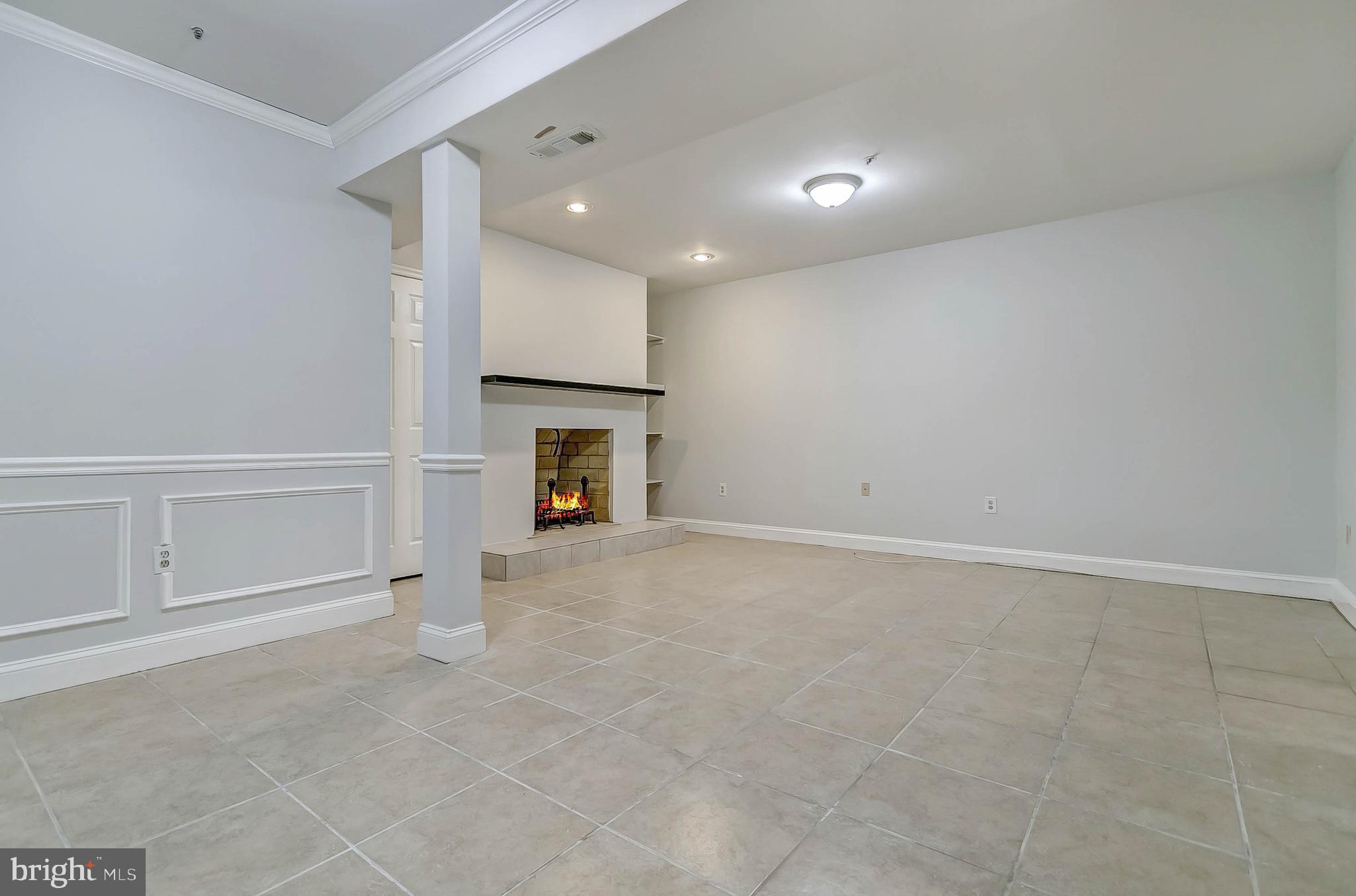 11804 Bishops Content Road Bowie, MD 20721 - Photo 22 of 27 Level level living room with fireplace