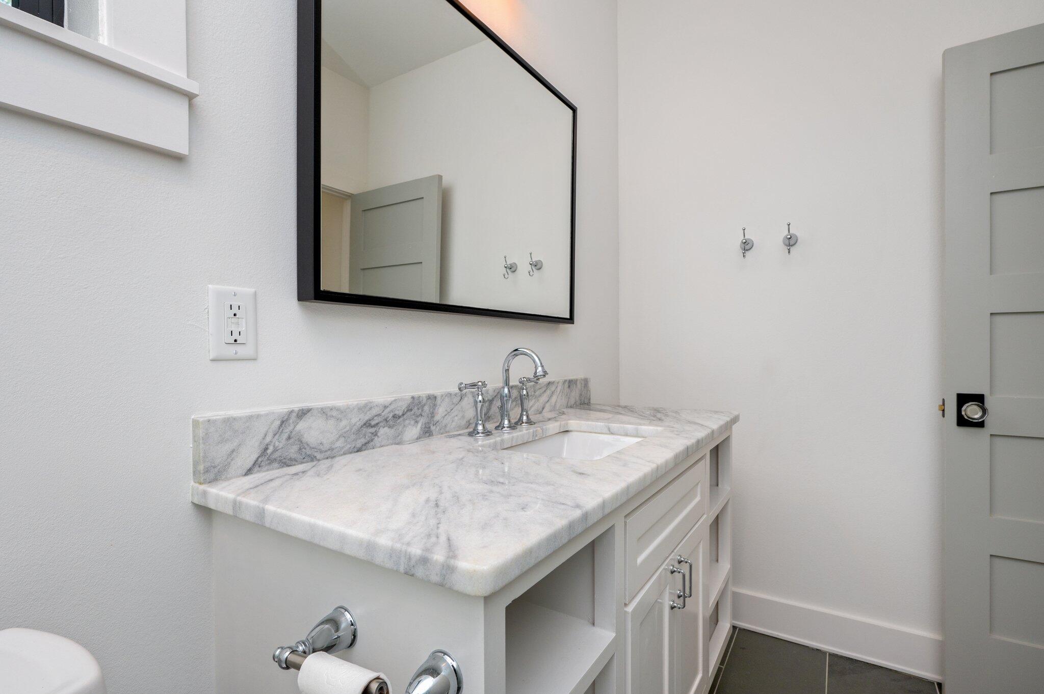 164 Bay Trace Santa Rosa Beach, FL 32459 - Photo 86 of 90 a bathroom with a granite countertop sink and a mirror