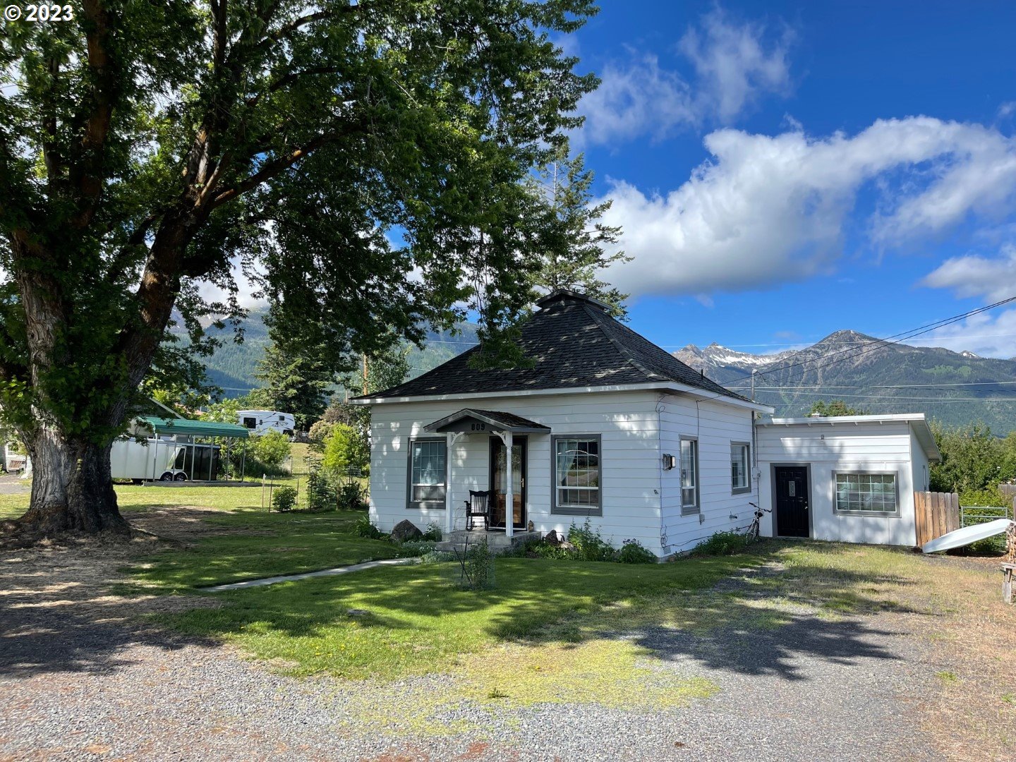 a front view of a house with a garden