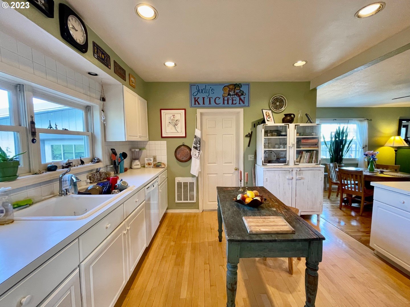 809 South Lake Street Joseph, OR 97846 - Photo 14 of 38 a kitchen with stainless steel appliances a stove a sink dishwasher and cabinets with wooden floor